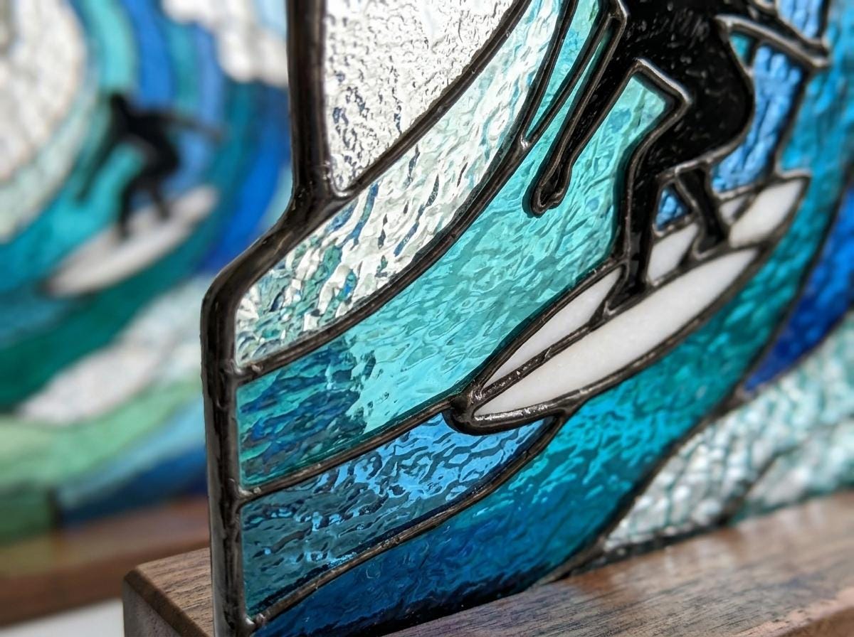 Ocean Surf glass bookend set near a bright window