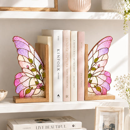 Pink Butterfly Wing glass bookend set near a bright window