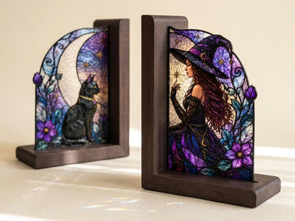 Witch and Black Cat glass bookend set near a bright window
