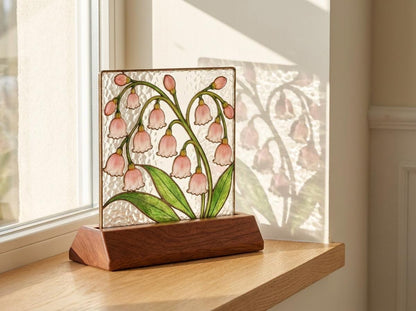 Detail view of the pink lily of the valley stained glass artwork