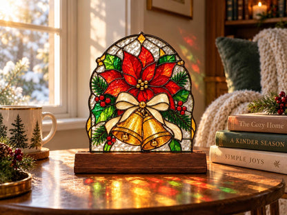 Poinsettia Bell Christmas Stained Glass Tabletop Decor with Wood Base displayed in natural light