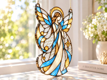 Blue and gold guardian angel glass ornament hanging in natural light