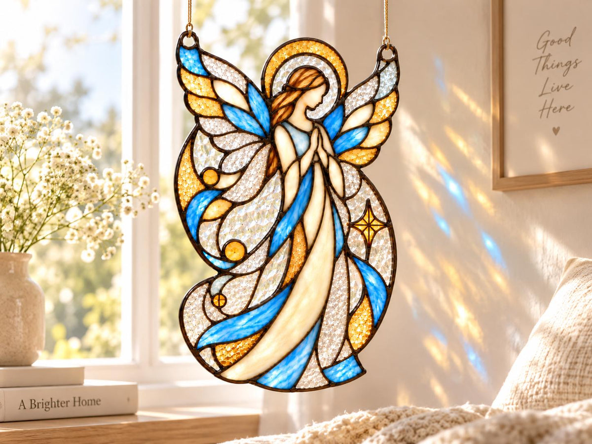 Praying angel window hanging casting blue and gold reflections indoors