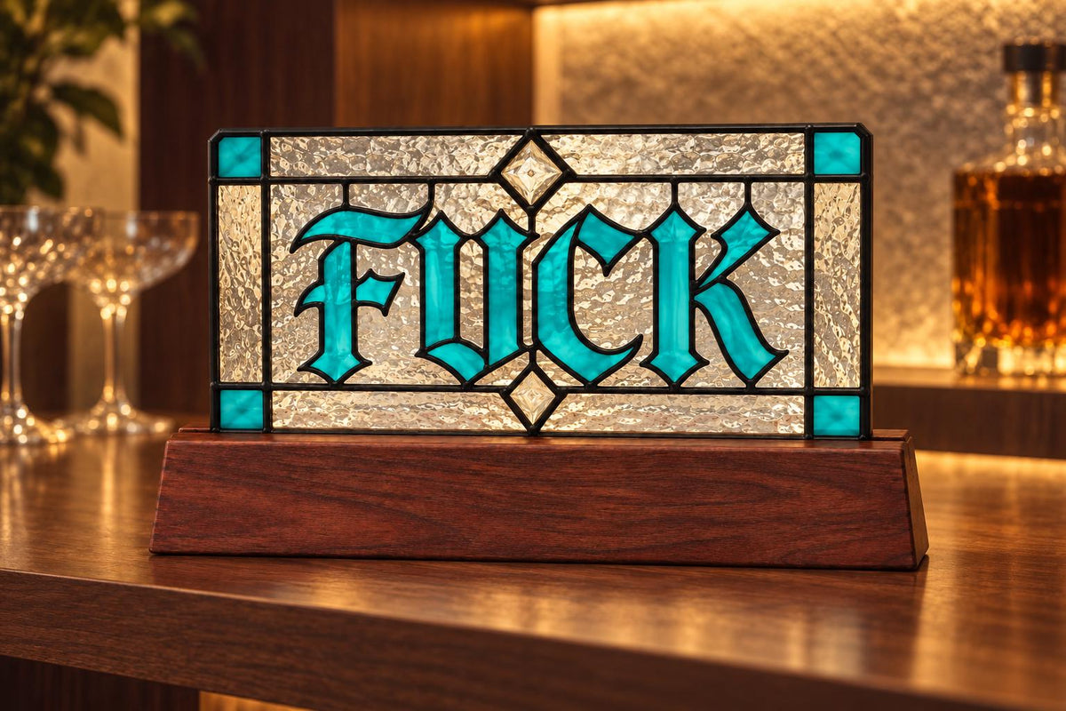 Detail view of the funny swear word sign stained glass artwork