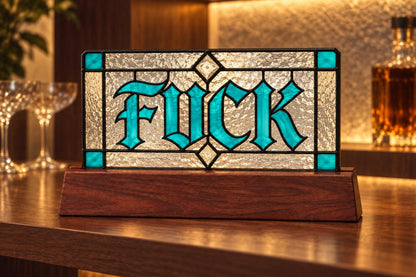 Detail view of the funny swear word sign stained glass artwork